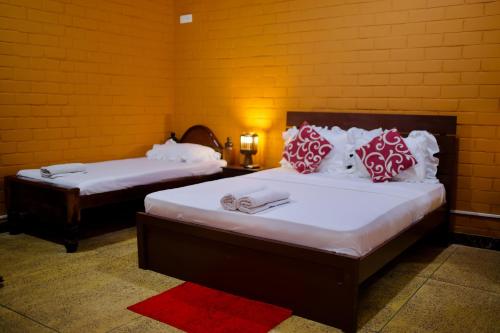 Кровать или кровати в номере Sevenday Hotel