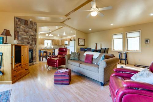 a living room with a couch and a kitchen at Deep Creek Lake Townhome with Deck and Water Views in Oakland