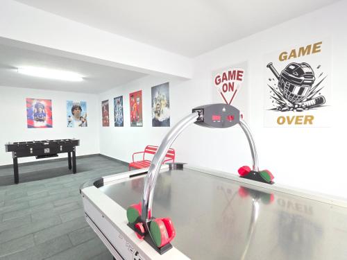 a room with a ping pong table and a sink at RODRIGUES ViLLA in Funchal