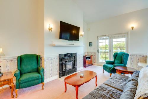 a living room with a couch and chairs and a fireplace at Ocean Shores Condo with Private Tub Less Than 1 Mi to Beach! in Ocean Shores