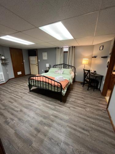 a bedroom with a bed in the middle of a room at Cozy Studio in Enfield in Enfield