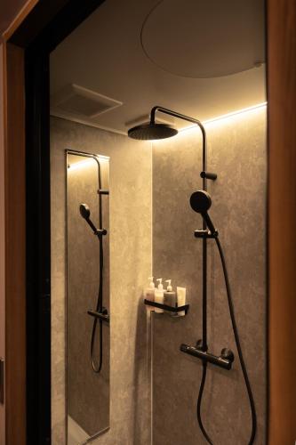 a bathroom with a shower with a shower at Tokinoma ときのま in Kawagoe