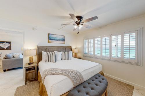 a bedroom with a bed and a ceiling fan at Pinnacle Port C2-404 in Panama City Beach
