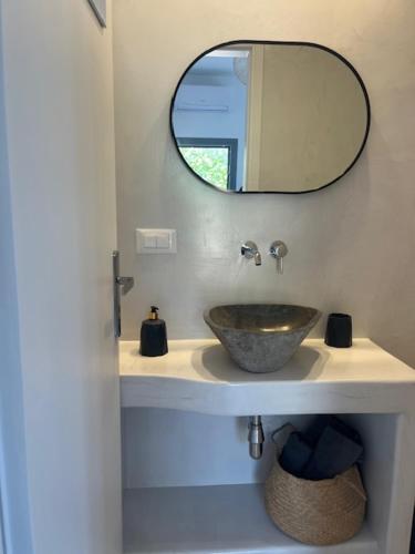 a bathroom with a sink and a mirror at The Dream in Ios Chora