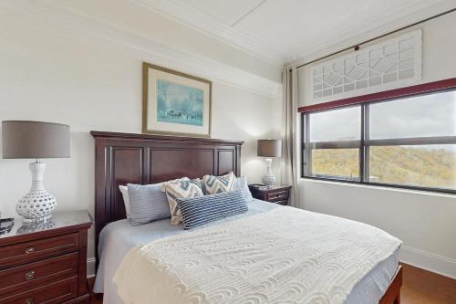 a bedroom with a large bed and a window at Misty Morning in Sugar Mountain