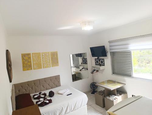 TV a/nebo společenská místnost v ubytování Apartamento próx ao centro com vaga