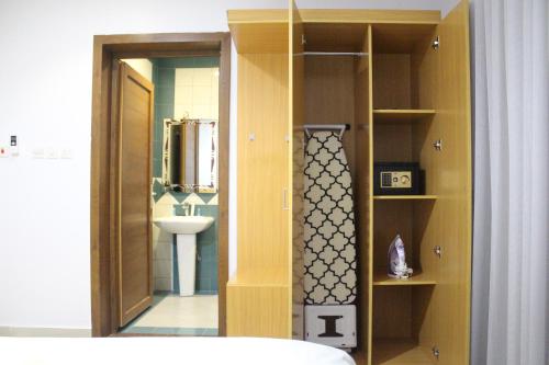 a bathroom with a sink and a toilet in a room at رفا للشقق المخدومة-اقتصادي in Riyadh