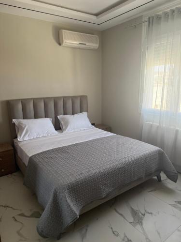 Ένα ή περισσότερα κρεβάτια σε δωμάτιο στο Apartement luminéo hammamet nord