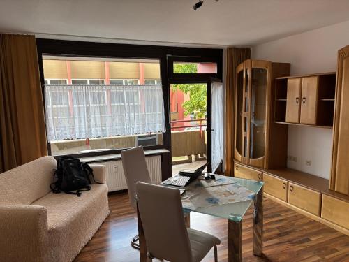a living room with a couch and a table at Ferienwohnung Studio 205 im Taunusblick in Lahnstein