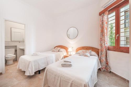 Postel nebo postele na pokoji v ubytování Casa Faro