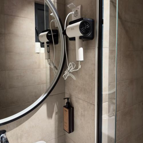 a bathroom with a shower with a shower head at Motel Krnjevo OAZA in Krnjevo