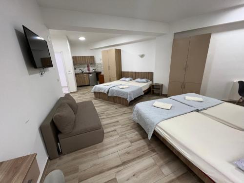 Ένα ή περισσότερα κρεβάτια σε δωμάτιο στο Paradiso Apartments City Center