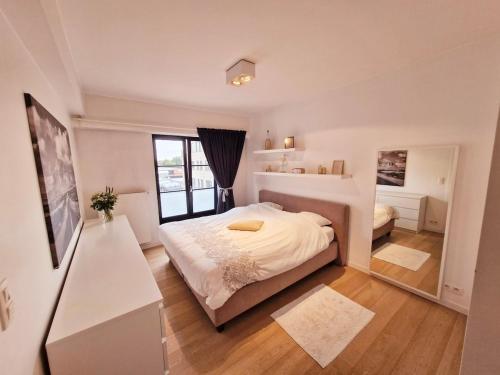 Una cama o camas en una habitación de Petit cocon au centre de waterloo