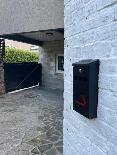 a black box on the side of a building at Foundry Street Apartment 2 - Dunfermline city centre in Dunfermline