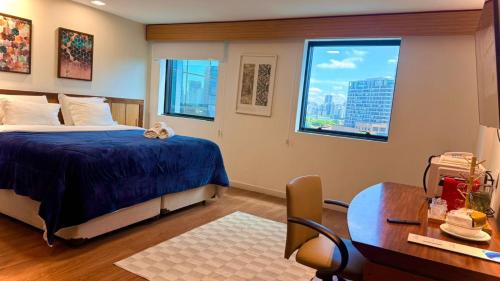 Ένα ή περισσότερα κρεβάτια σε δωμάτιο στο M N Flats Hotel Av Ibirapuera 2927