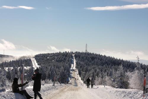 a group of people on a snow covered ski slope at Appartements Gahler - Kurort Oberwiesenthal in Kurort Oberwiesenthal