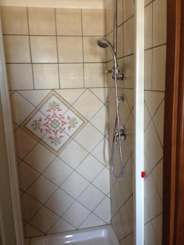 a bathroom with a shower with a tub at Villa Malandrino Guest House in Agropoli