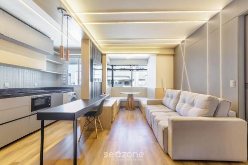 a living room with a couch and a table at House with Jacuzzi, just 10min from the sea OSH in Florianópolis