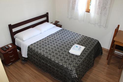 Ένα ή περισσότερα κρεβάτια σε δωμάτιο στο Hotel Turiassú