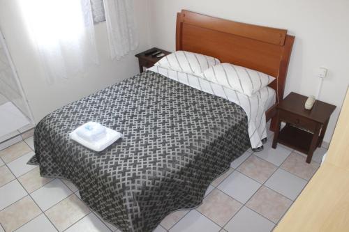 Ένα ή περισσότερα κρεβάτια σε δωμάτιο στο Hotel Turiassú
