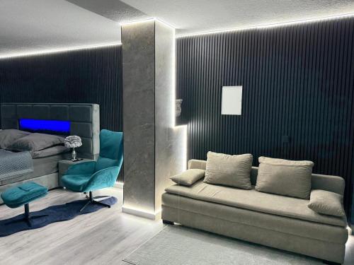 a living room with a couch and a bed at Modern luxury apartment in Koblenz in Koblenz