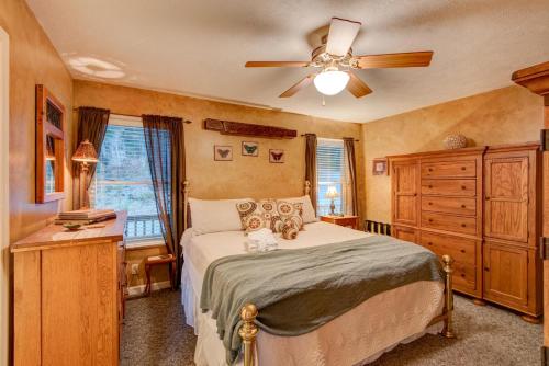 a bedroom with a bed and a ceiling fan at A Big View in Seven Devils