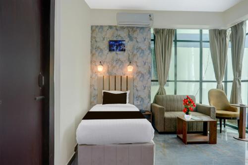 Katil atau katil-katil dalam bilik di Townhouse OAK Hotel Dream Palace