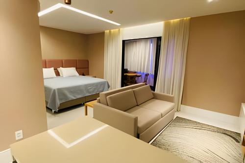 Llit o llits en una habitació de Prédio Mercure Boulevard.