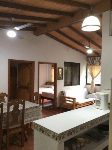 a living room with a couch and a table at Hotel Villa Tulipanes in Zihuatanejo