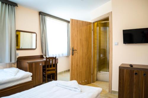 Posteľ alebo postele v izbe v ubytovaní ZGODA Kompleks Hotelarski