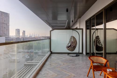 a room with a view of a city at Brand New Grand 2BR Duplex apartment in Jumeirah Village Circle with Pool, Gym and kids playground in Dubai