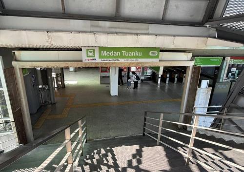 an airport terminal with a sign that reads nielsen terminal at Quill Residence - Sky Glass Condo by Azmila in Kuala Lumpur