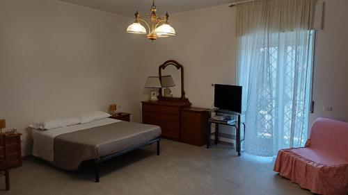 Postel nebo postele na pokoji v ubytování Casa Vacanza Elena