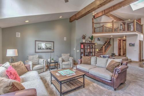 a living room with couches and a table at Lazy Bear in Breckenridge
