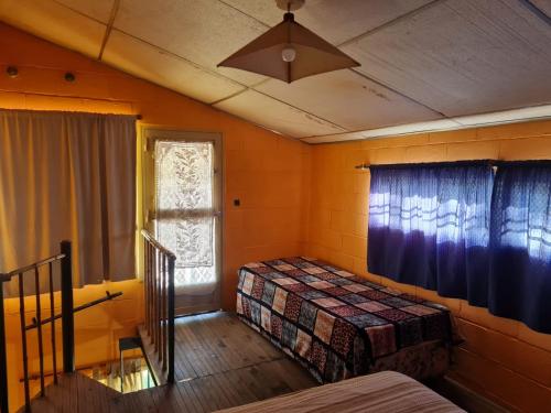 Postel nebo postele na pokoji v ubytování Cabañas los Nonitos