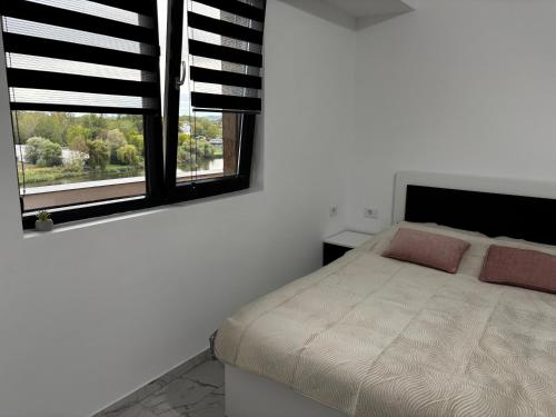 Ένα ή περισσότερα κρεβάτια σε δωμάτιο στο Apartament ștrand