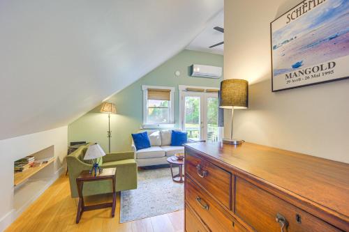 a living room with a large wooden dresser in a room at Romantic, Secluded Vermont Getaway with Hot Tub in Hancock