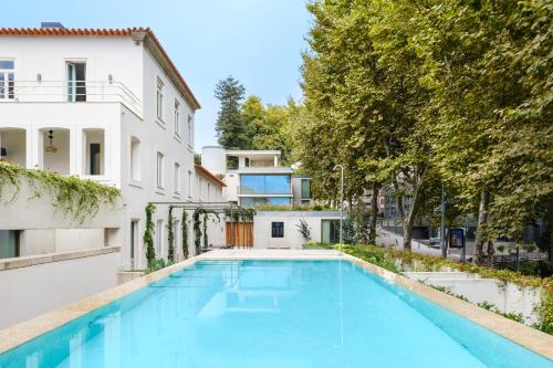 a swimming pool in the backyard of a house at City Retreat by Reframe stay in Porto in Porto