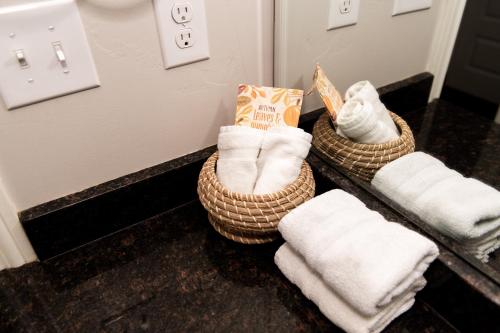 a bathroom with towels in baskets on a counter at Film-featured sleeps 18 hot tub fire pit decks in Heber City