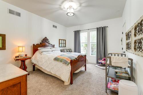 Un dormitorio con una cama grande y una ventana. en Sleek Getaway on Lake Wawasee with Private Dock!, en North Webster