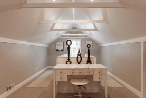 a home office with a desk and a chair at Heber base camp sleeps 7 fire pit pets ok AC in Parkview Trailer Court