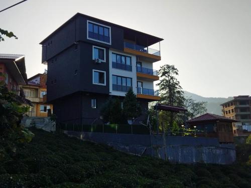 a building on top of a hill with at Sama house in Rize
