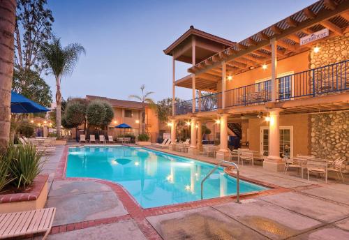 a swimming pool in front of a hotel at Club Wyndham Dolphin's Cove in Anaheim
