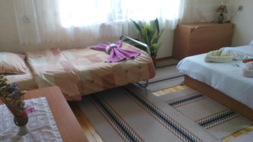 Ένα ή περισσότερα κρεβάτια σε δωμάτιο στο Guest House Jani