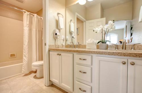a bathroom with a sink and a toilet and a mirror at Pacific Plaza #509 - Lighthouse Lodge - 1BdrmUp-K-QSofa in Oceano
