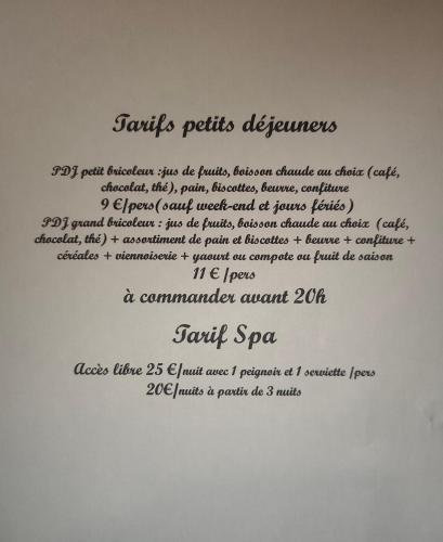 a whiteboard with a document with writing on it at L'atelier de Guytou et Spa in Cheval-Blanc