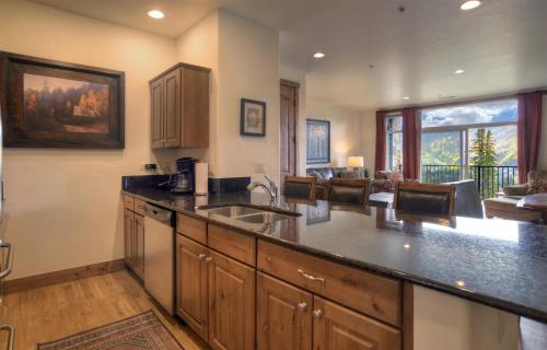 a kitchen with a sink and a counter top at Peregrine Point 106 in Durango Mountain Resort