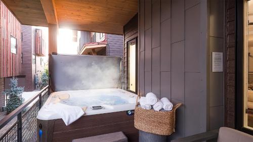 a hot tub on the balcony of a house at Principal House in Steamboat Springs