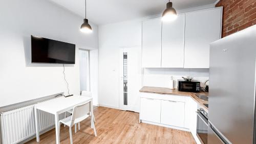 Kuchyň nebo kuchyňský kout v ubytování Nawrot Hideaway By DreamAp