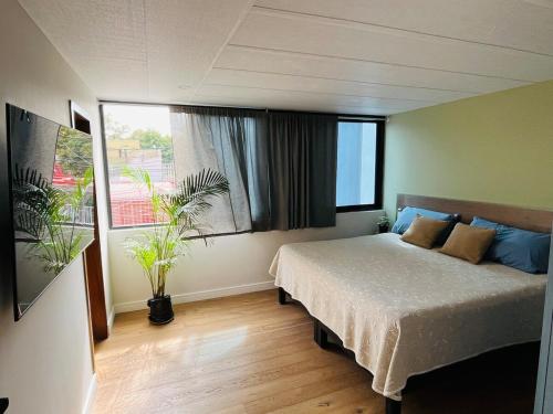 a bedroom with a bed and a large window at BIG HOUSE, máximo 22 personas !!!!!!!!!!!!!!! in Guadalajara